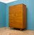 A freestanding double door teak wardrobe from Stonehill Made during the 1960s Fitted out with a clothes rail. The style of...