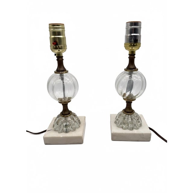 This charming pair of petite vintage mid-century table lamps features a beautifully layered design combining clear ribbed...