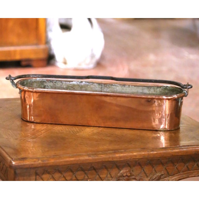 This authentic antique French poissonnière exemplifies the utilitarian elegance of traditional country kitchen copper....