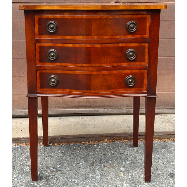 An Hepplewhite Style Crossbanded Mahogany and Satinwood Inlaid Three-Drawer Work Table. Measures 20" in width, 15" in...