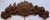 A solid oak, densely carved pediment with a central sunburst surrounded by pomegranates, roses, apples, a daisy, and...