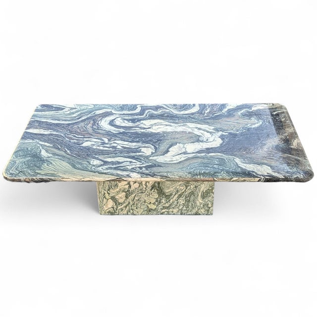 Postmodern green marble coffee table with a rectangular top, bullnose edge detail, and sculptural plinth base. The table...