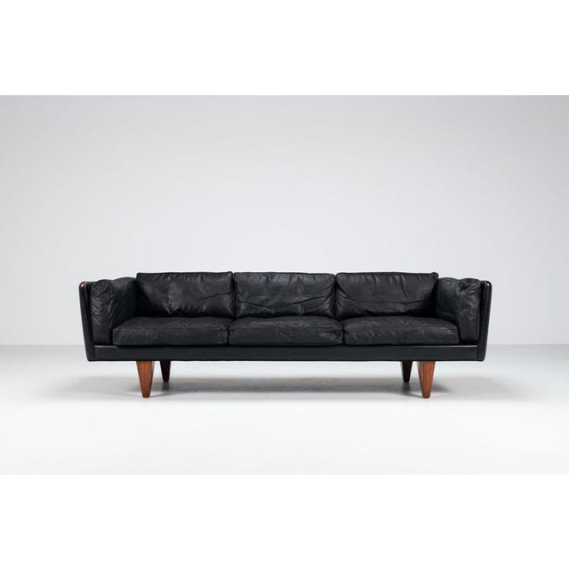 A beautiful and characterful Model V11 three-seat sofa designed by Illum Wikkelsø and produced by Holger Christiansen in...