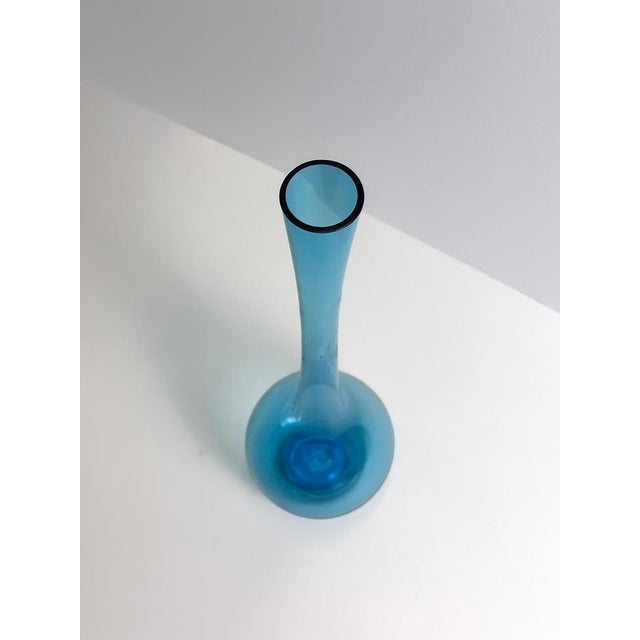 This tall mid-century modern bottle vase was designed by Swedish artist Arthur Percy for Gullaskruf Glasbruk in the 1950s....
