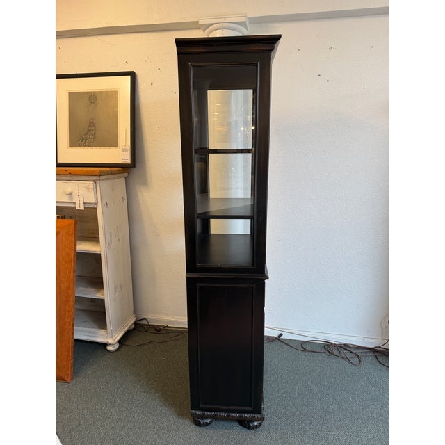 Design Plus Gallery presents the French Empire Cabinet from Restoration Hardware. This cabinet has a black painted surface...