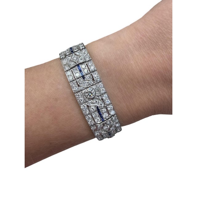 This stunning bracelet from the Art Deco era consists of numerous old European and single cut diamonds weighing...