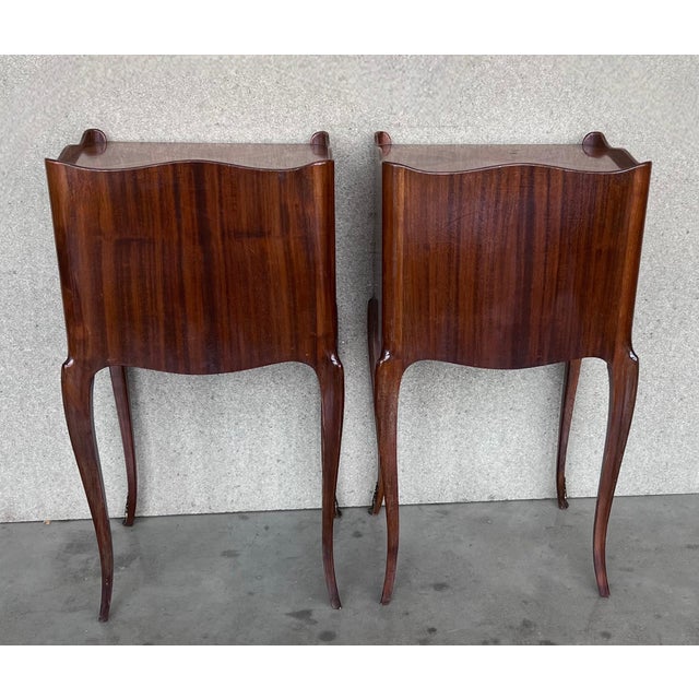 A pretty pair of French, inlaid kingwood, one drawer nightstands with open shelf , circa 1910. Pair of French Louis XV...