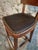 This antique French chair dates from the early 1900s and is crafted from solid beechwood. The backrest is formed from a...