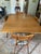 A 1950s mid-century modern Haywood-Wakefield drop-leaf dining table with 4 chairs is a classic example of American...