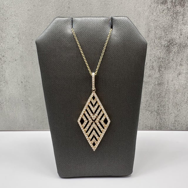 This designer Effy geometric pendant necklace is crafted in 14kt yellow gold and features a modern architectural design...