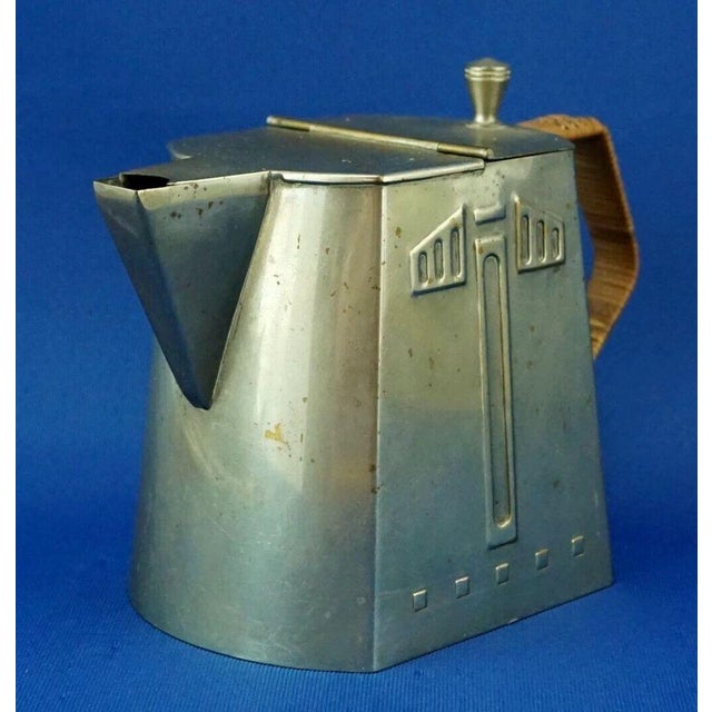 Measurements: height: 14 cm; width: 19.5 cm; depth: 10 cm item : beautiful, elegant metal teapot with a wicker handle and...