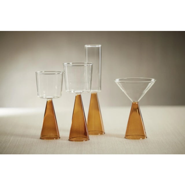 This set features four sleek champagne flutes and is aesthetically pleasing, perfect for adding a touch of sophistication...