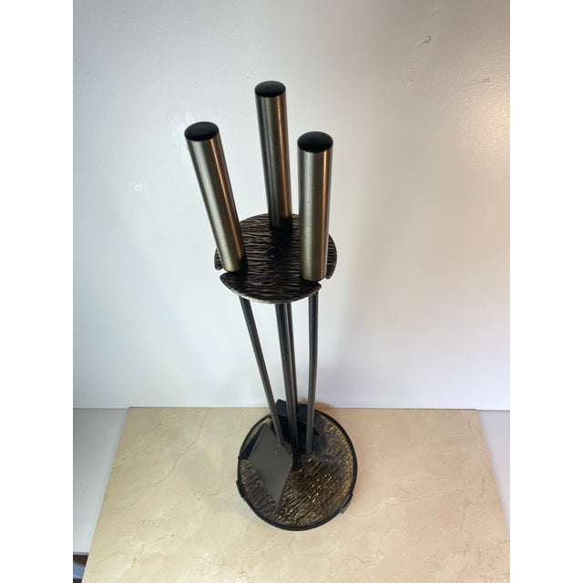 Vintage 4-piece fireplace tool set in a sleek mid-century modern silhouette — three slim iron tools (poker, brush, and...