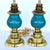 Captivate your space with this stunning, authentic pair of 1960s Hollywood Regency table lamps manufactured by the...