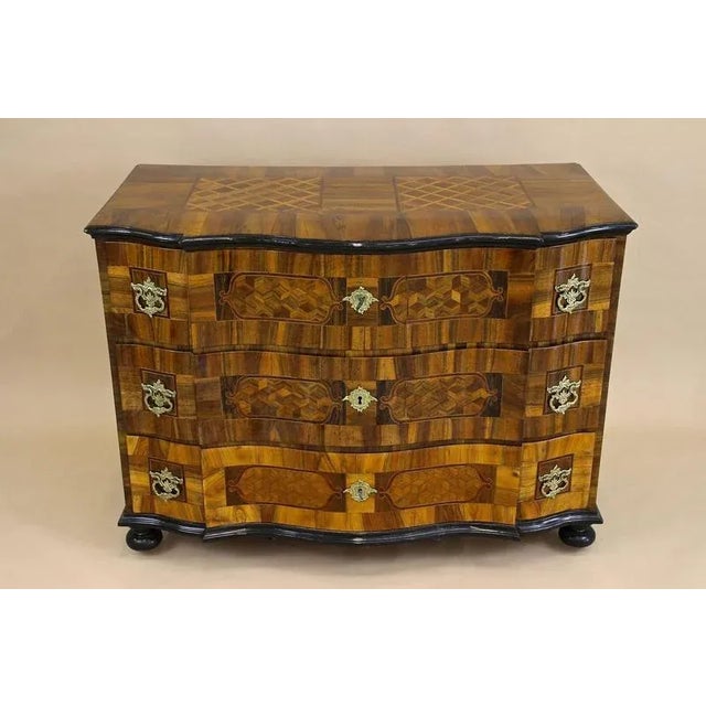 Remarkable 18th century Baroque chest of drawers out of Austria. Elaborately made in the period around 1760, this...
