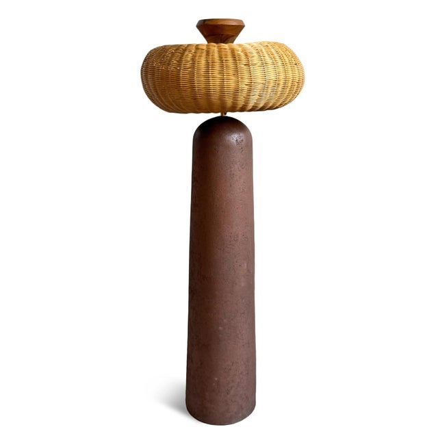 A striking blend of natural texture and sculptural form, this floor lamp brings artisan-inspired warmth to any space....