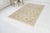 This is a vintage Turkish Oushak rug from the Mid 20th Century. The piece was hand-knotted.