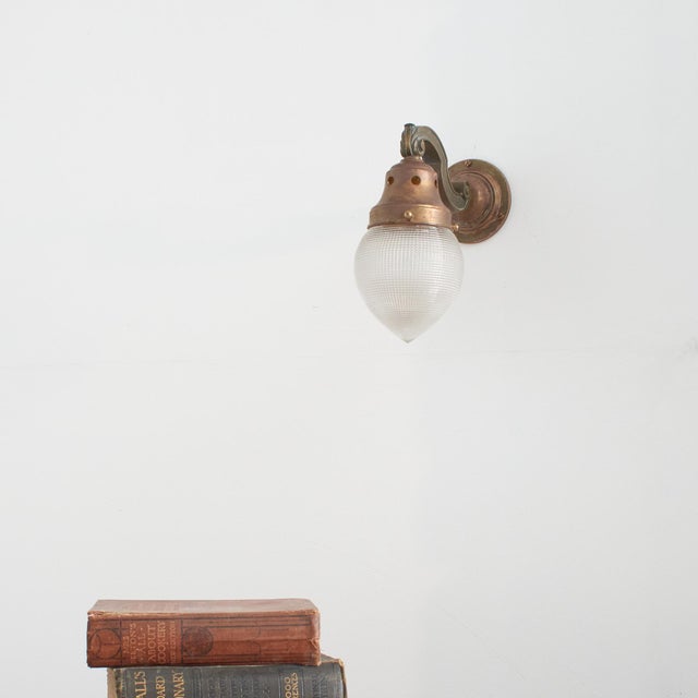 Antique decorative acorn holophane brass wall light – c an elegant antique holophane brass wall light. The light has a...