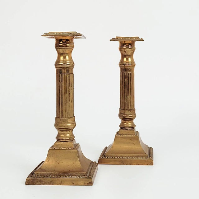 A pair of English Neoclassical provincial candlesticks, circa 1780.