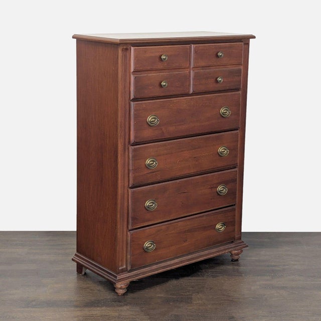 This Broyhill dresser features a sturdy wood build and a timeless chestnut finish. It has five spacious drawers for easy...