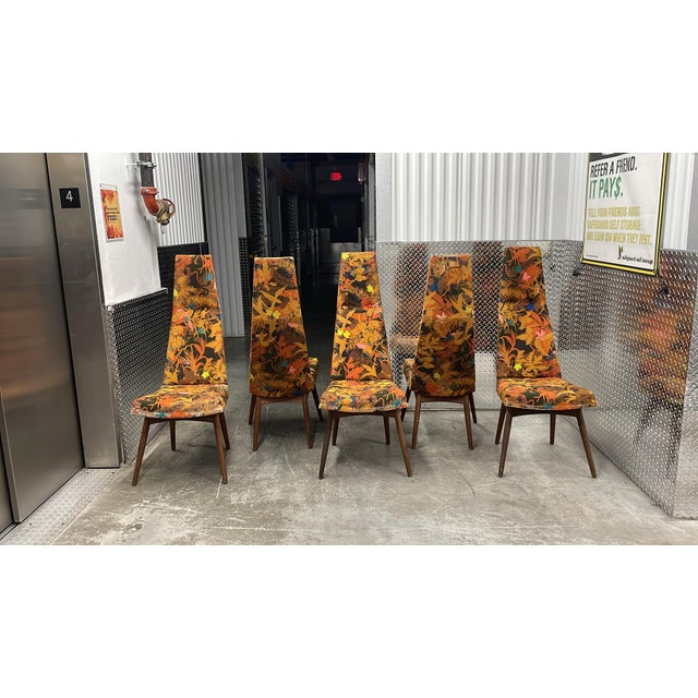 These model 2051-c dining chairs Attributed to Adrian Pearsall have sculptural walnut frames and legs that exemplify his...