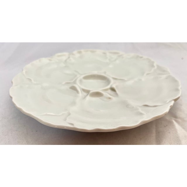 Imported from Germany. Hutschenreuther white porcelain oyster plate. The plate holds six oysters and has a lovely...