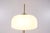 1970s floor lamp in gilded brass and acrylic, with an adjustable diffuser. H 160 cm x Diffuser diameter 37 cm. Base...