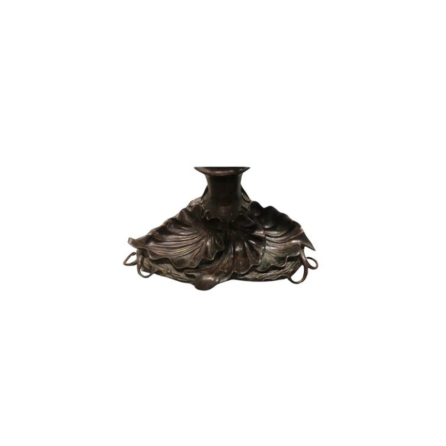English, 20th century. A vintage bronze dog form umbrella stand or cane holder with lily pad base after the original by...