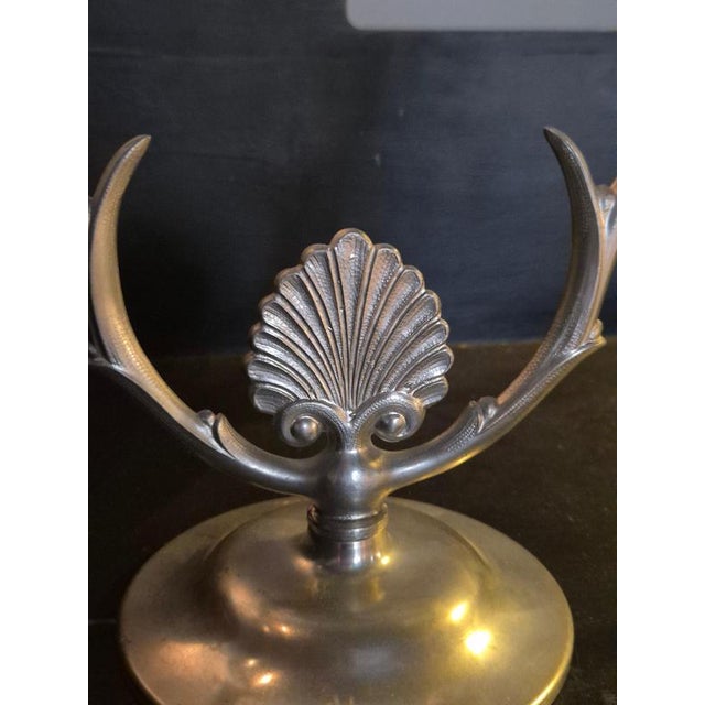 A pair of elegant Swedish Grace pewter candelabras, manufactured in Sweden 1934/H8. In good condition, one base with a...