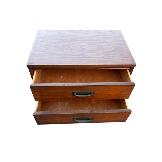 Mid-Century Modern Walnut Two-Drawer Nightstand With Original Hardware A classic Mid-Century Modern nightstand featuring...