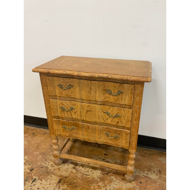 A wonderful little chest of drawers in Oak with serpentine curved front. Brass drawer pulls. Denmark, circa 1970s. Perfect...