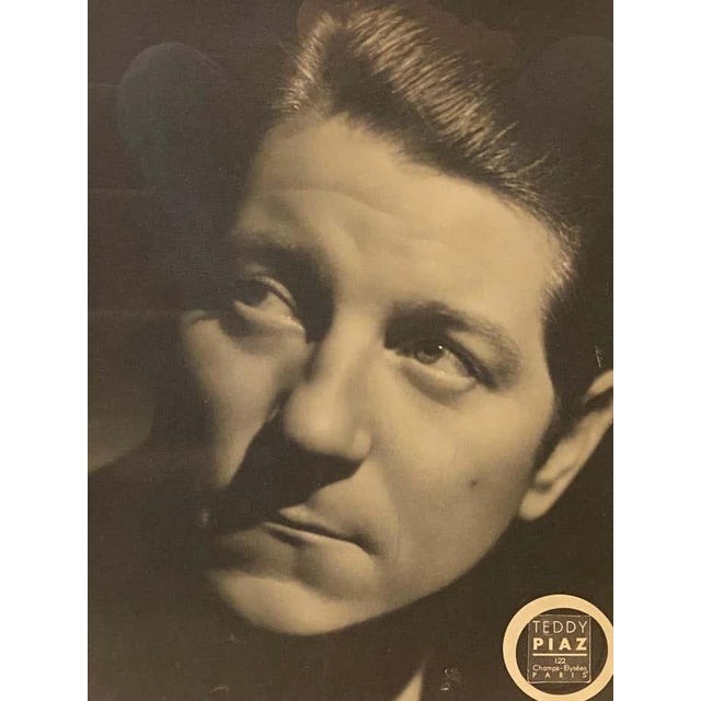 This vintage photograph of French actor Jean Gabin on silver paper bears the artist Teddy Piaz's seal but is not numbered....