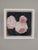 This artwork features a delicate arrangement of spring peonies, rendered in soft pink hues against a deep, contrasting...