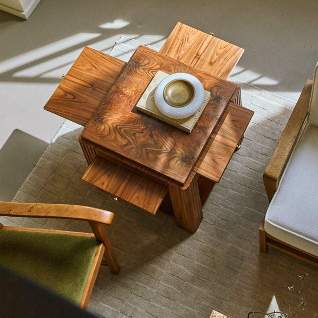 Designed to transform a living space into a setting of engagement and discovery, emerges this Italian Art Deco walnut...