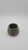 Hand-thrown studio pottery bowl featuring a rounded silhouette with carved geometric motifs in exposed clay beneath a...