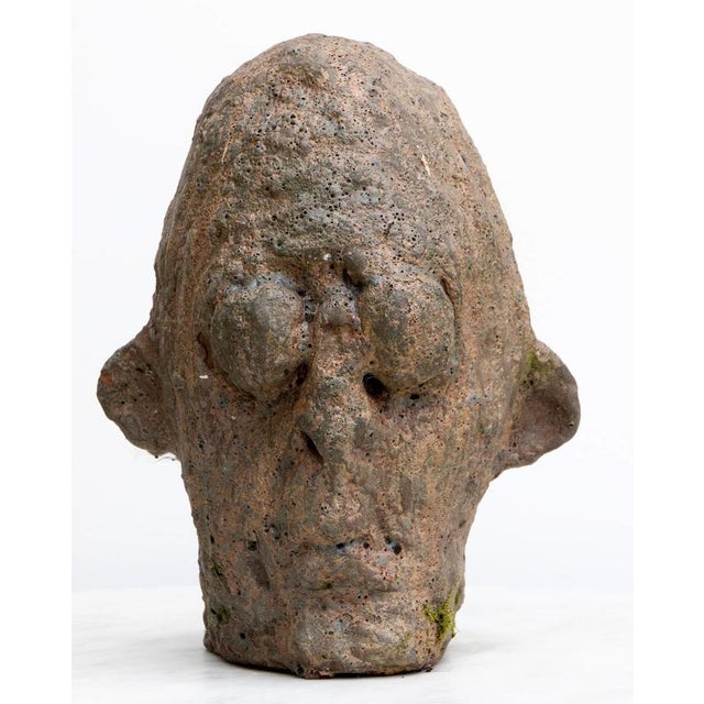This ceramic head sculpture from the Testas series, titled Testa Nº12, is an expressionist exploration of the human face...