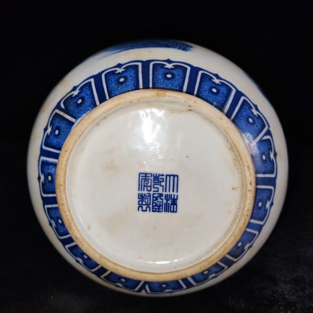 This elegant blue and white porcelain vase, shaped in the classic "Yuhuchun" (pear-shaped) silhouette, is a stunning piece...