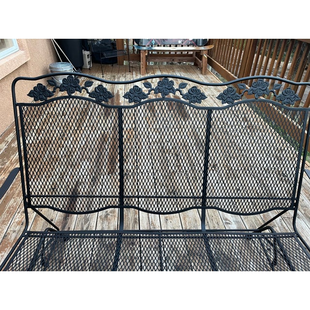 Woodard Wrought Iron Patio Glider Loveseat. Crafted by the iconic Woodard Furniture Company, this classic piece features...