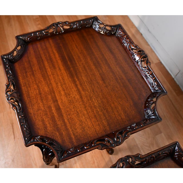 We are pleased to offer this beautiful pair of English Chippendale side tables, from the 1940s . This pair is made of...