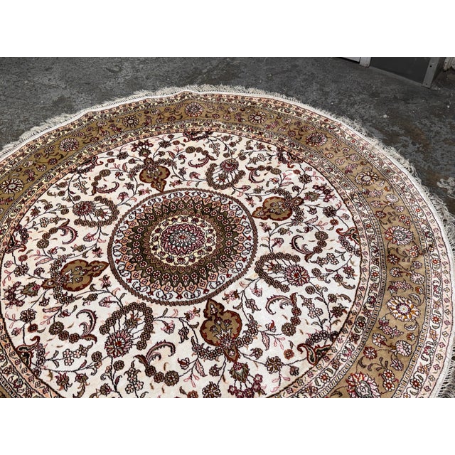 Design Plus Gallery presents s Silk Floral Medallion Area Rug. This circular carpet showcases a finely detailed floral...