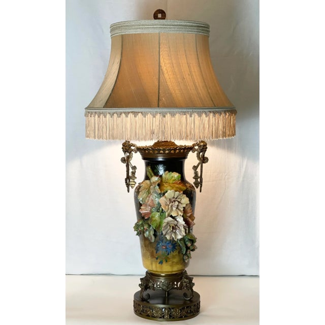 This Impressive Over-Scale lamp features dramatic ceramic three-dimensional flowers and buds in pleasing tones of pinks,...