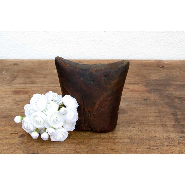 This antique Sidama headrest is more than just a piece of wood; it's a testament to the artistry and traditions of...