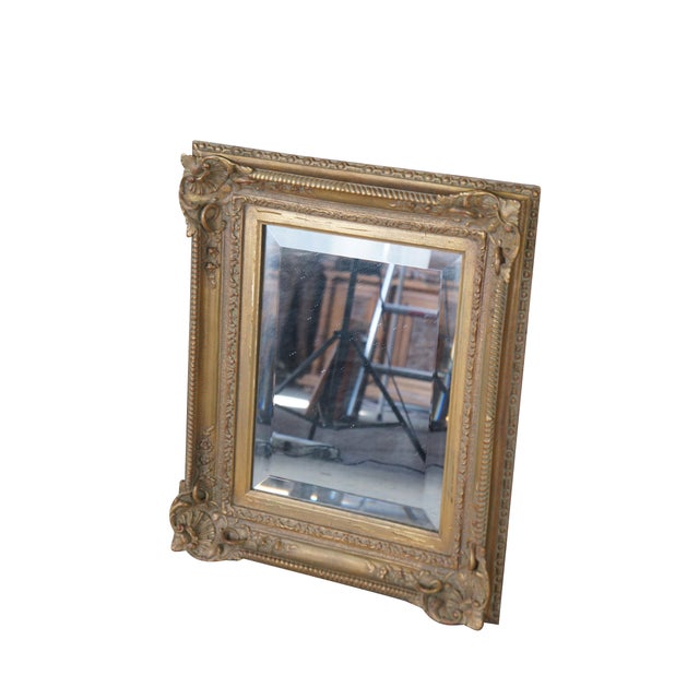 Vintage baroque rococo style gold carved foliate frame with beveled mirror. Dimensions: 20 x 3" x 23"; sans 11.5" x 15.5"