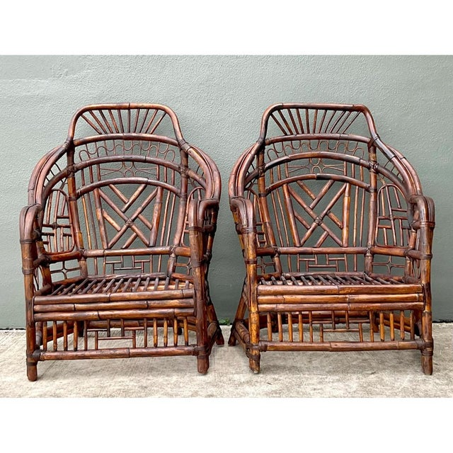 This striking pair of vintage high back Brighton rattan lounge chairs showcases an intricate lattice design that speaks to...