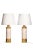 Each lamp features a cylindrical base with a striking combination of off-white glazed ceramic and rich gold accents. The...