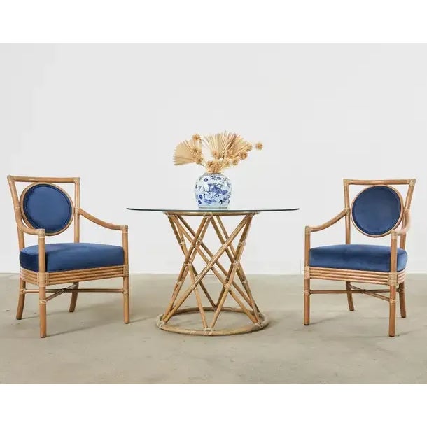 Stately set of six rattan salon armchairs or dining chairs made in the coastal organic modern style by McGuire. These rare...