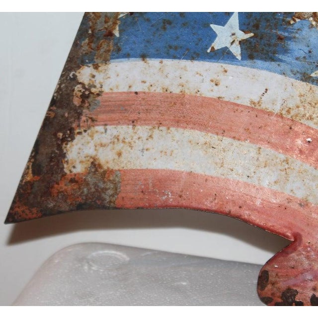 This fun and folky 20thc original painted parade flag sign was used to hand in the windows during patriotic events. In...