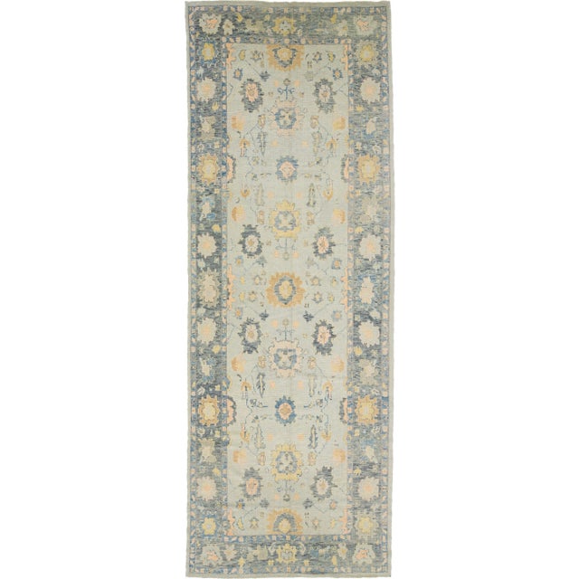 Beautiful modern Oushak hand-knotted Wide wool rug with a gray field. This Oushak rug has multicolor accents all over a...
