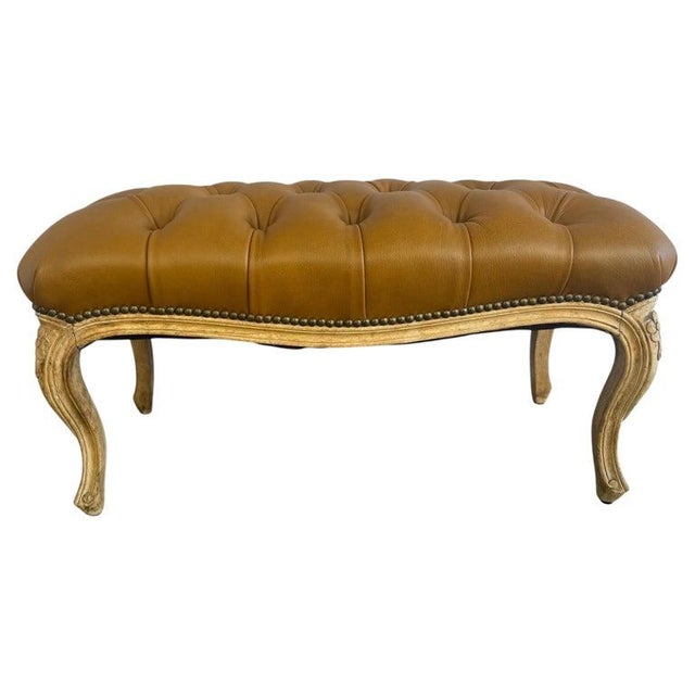 A charming vintage French Louis XV style tufted bench, embodying timeless Parisian elegance and artisanal craftsmanship....