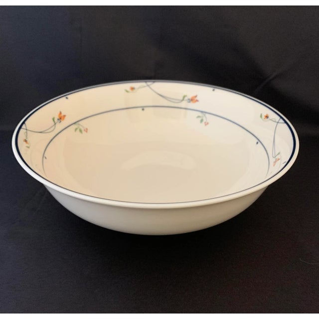 Beautiful good sized bone china serving bowl decorated with lovely tiny orange and burnt umber flowers with curved stems...